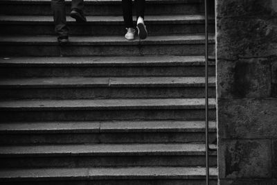 Low section of people walking on steps