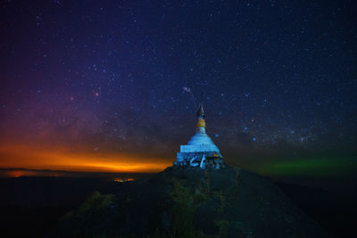 View of illuminated building against sky at night