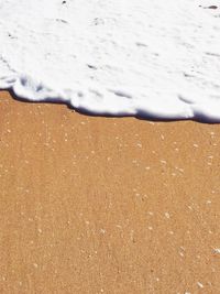 Close-up of snow on beach