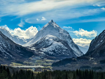 Panoramic view of snowcapped mountain against sky during winter