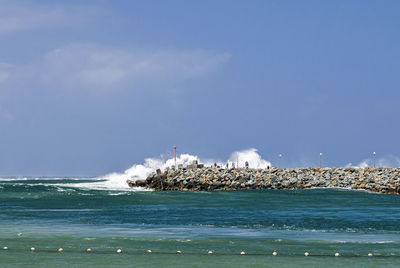 Scenic view of sea against blue sky