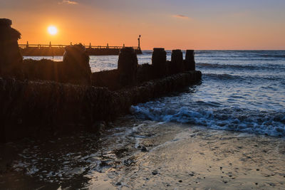 Scenic view of sea against sky during sunset