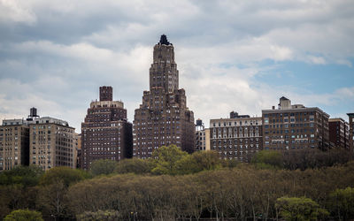 View of buildings against cloudy sky