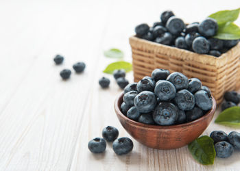 Freshly picked blueberries on a old wooden background. concept for healthy eating