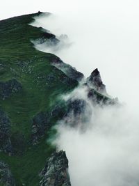 Scenic view of mountains in foggy weather