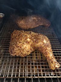 High angle view of meat on barbecue grill