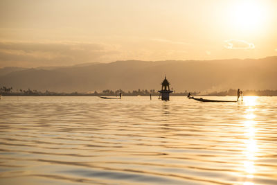 Scenic view of river at sunset