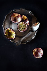 High angle view of passion fruits in bowl on table