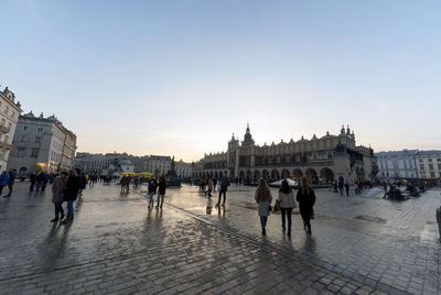 People walking on street in city