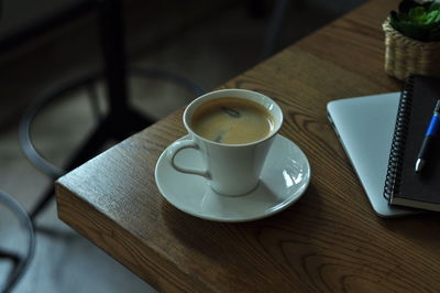 High angle view of coffee cup on table