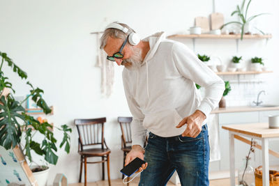 Side view of man working in workshop