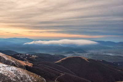 Scenic view of mountains against sky during sunset