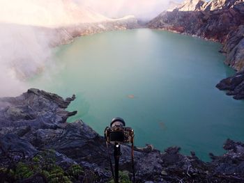 Camera against kawah ijen