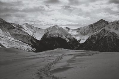 Scenic view of snowcapped mountains against sky