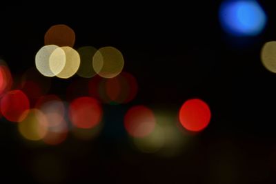 Defocused image of illuminated lights at night