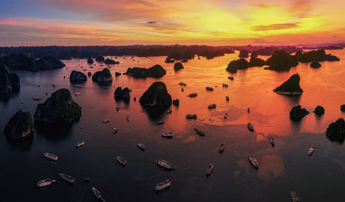 High angle view of beach against sky during sunset