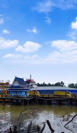 Pier over river against sky