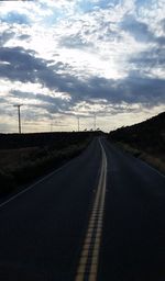 Road against sky at sunset