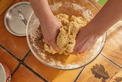 Midsection of woman preparing food in kitchen