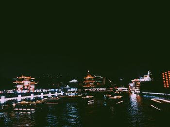 Illuminated buildings in city at night