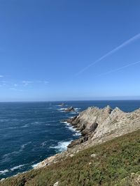 Scenic view of sea against blue sky