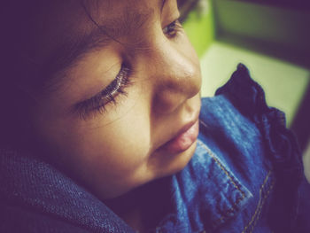 Close-up portrait of a girl looking away