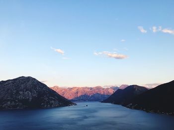 Scenic view of mountains against blue sky