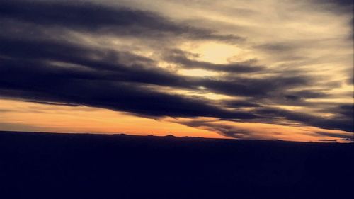 Scenic view of dramatic sky during sunset