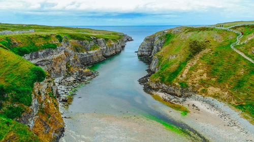 High angle view of sea shore against sky