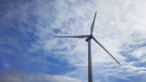 Low angle view of wind turbine against sky