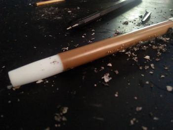 High angle view of cigarette on table