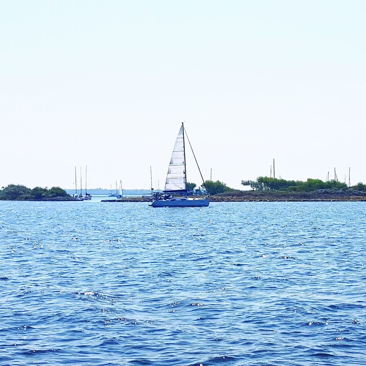 nautical vessel, transportation, water, mode of transport, boat, waterfront, clear sky, sea, copy space, sailing, rippled, tranquil scene, tranquility, sailboat, moored, nature, scenics, beauty in nature, travel, day