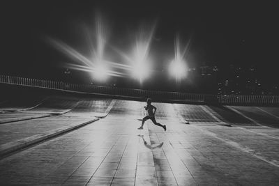 Man running on street at night