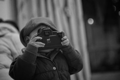 Boy photographing with camera