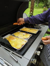 Cropped image of man holding food