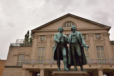 Low angle view of statue against building