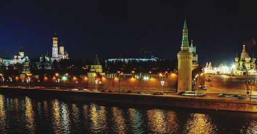 Illuminated buildings at waterfront