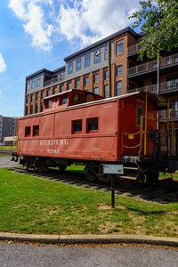 Train on railroad track against sky