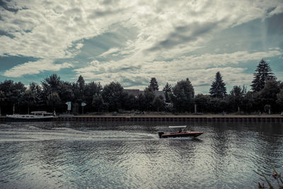 Boats in calm lake