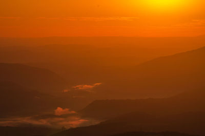 Scenic view of dramatic sky during sunset