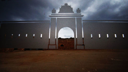 Built structure against cloudy sky