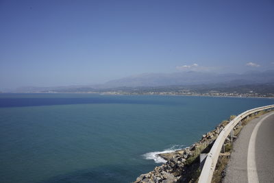 Scenic view of sea against clear blue sky