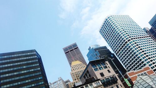 Low angle view of modern buildings against sky in city