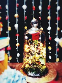 Close-up of illuminated bottles