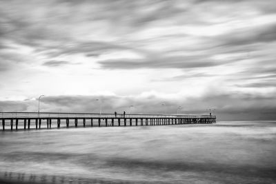 Scenic view of bridge over sea against sky