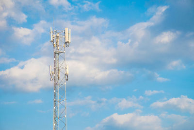 Low angle view of communications tower against sky