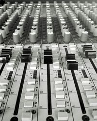 Close-up of sound mixer in recording studio