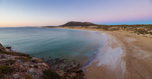 Scenic view of sea against clear sky during sunset