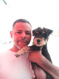 Portrait of smiling woman with dog