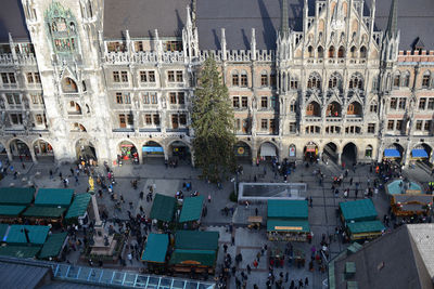 High angle view of people at marienplatz by building in city